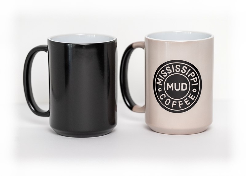 15 ounce Mississippi Mud Coffee logo reveal mug. Coffee mug turns from black to white, revealing Mississippi Mud Coffee logo, when mug is filled with hot liquid.